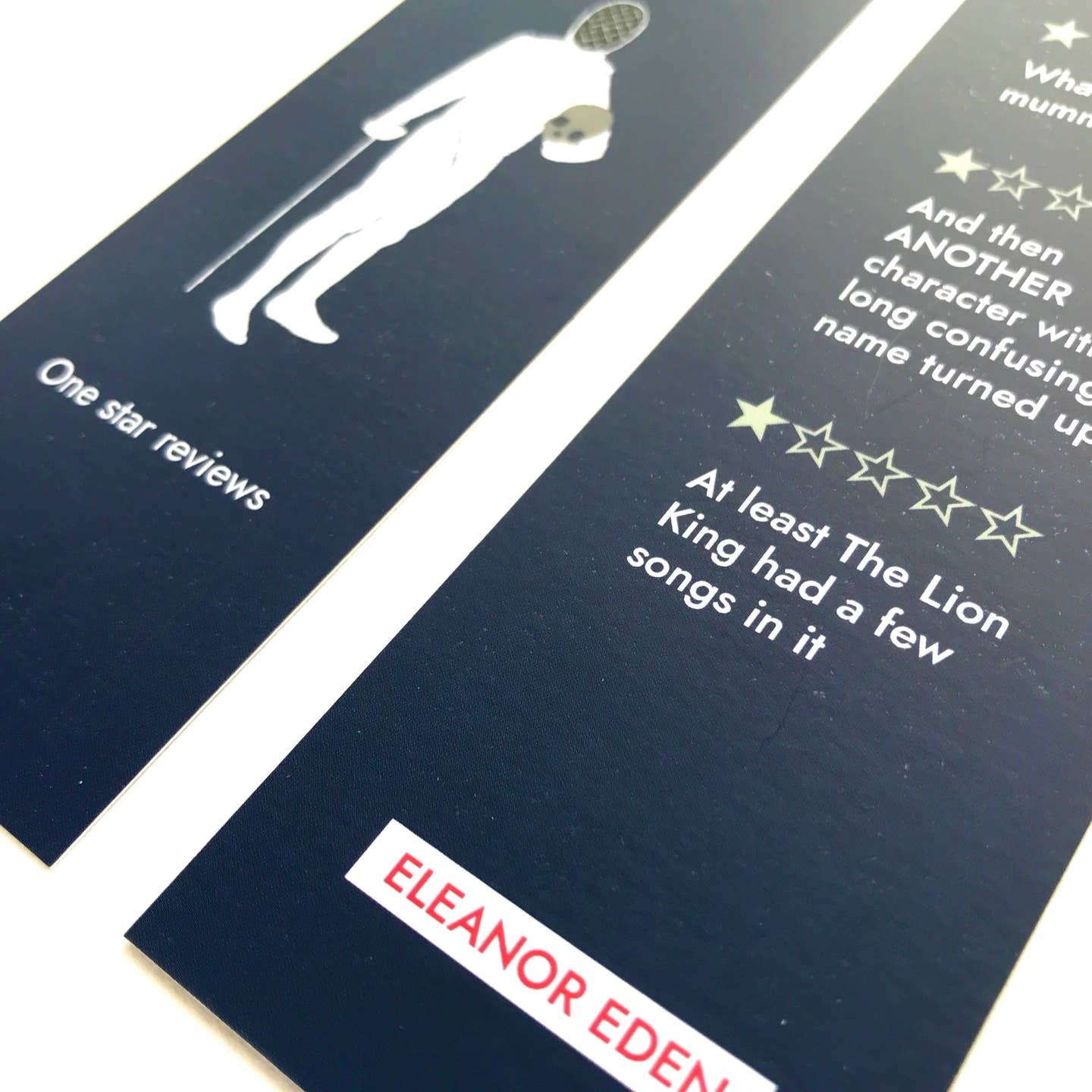 Two bookmarks with text and a silhouette of a person on a white background