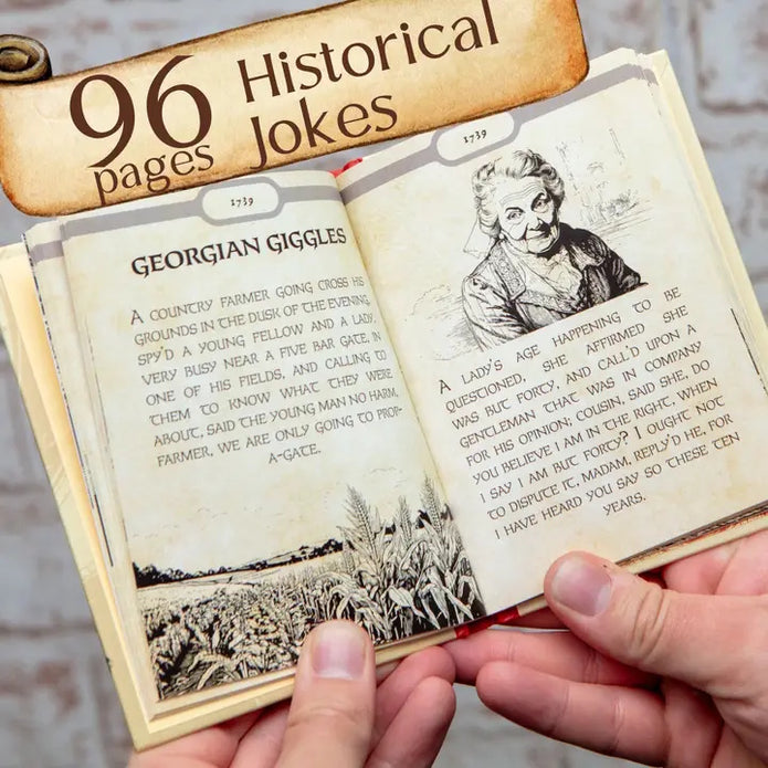 Open book with illustrations and text, held by a person against a rustic background.