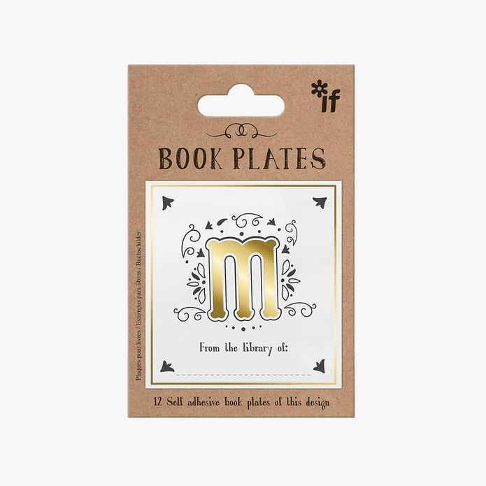 Packaging of book plates with a gold 'm' design on a white background