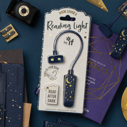 Reading light with packaging on a blue background with books and stationery items.