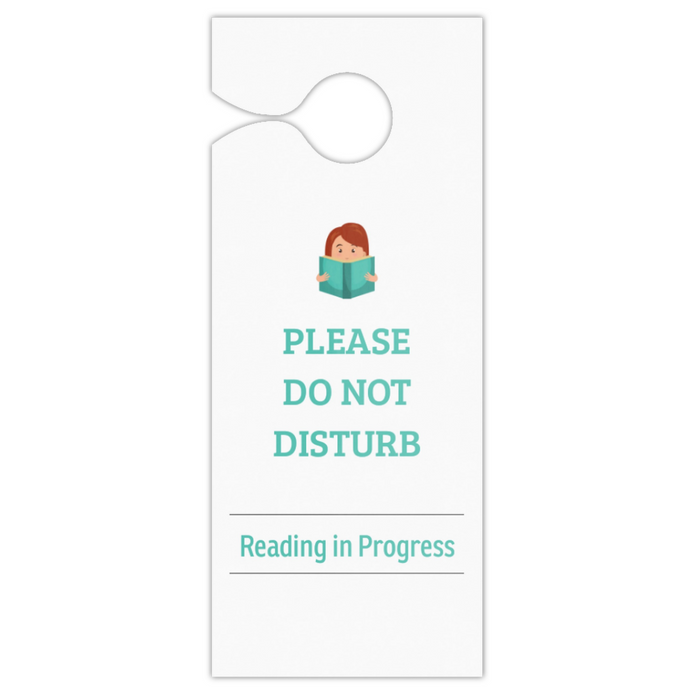 A white hanging door sign with a small cartoon illustration of a person reading, above the text 'PLEASE DO NOT DISTURB' and 'Reading in Progress' in teal, shown on a plain white background.