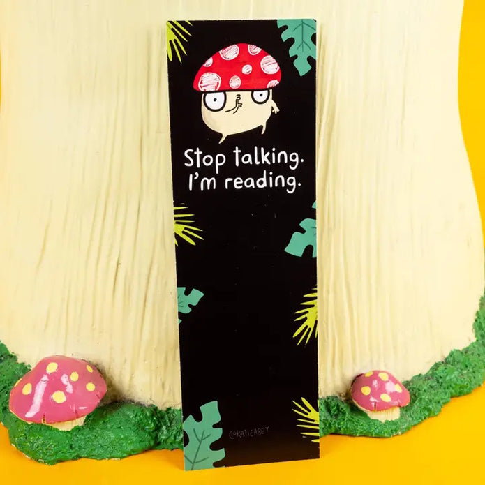 Bookmark with a cartoon mushroom on a background with mushrooms