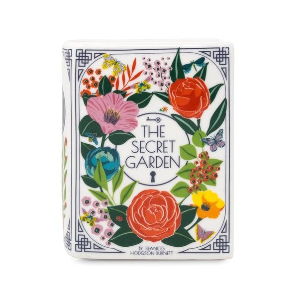 Floral design book shaped candle of 'The Secret Garden' with colourful flowers and leaves.
